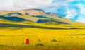 Photographer takes pictures of a mountain landscape, Torres del Paine National Park, Patagonia, Chile, South America.