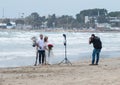 Photographer takes pictures of a young couple with a horse