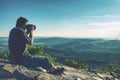 Photographer taking outdoor photos in autumn landscape Royalty Free Stock Photo