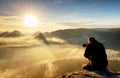 Photographer taking outdoor photos in autumn landscape Royalty Free Stock Photo