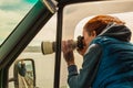 Photographer taking photo from camper car