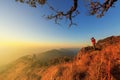 Photographer taking photo on high mountain Royalty Free Stock Photo