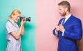 Photographer taking photo successful businessman. Businessman enjoy star moment. Paparazzi concept. Photosession for Royalty Free Stock Photo