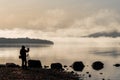 Photographer taking photos of the beautiful Loch Lomond in Scotland