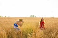 Photographer taking photos of girl model in a beautiful field
