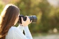 Photographer taking photos with mirrorless camera