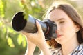 Photographer taking photos with a mirrorless camera