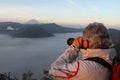 Photographer taking picture of Mount Bromo
