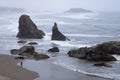 Photographer taking picture of rocks on Oregon Coast
