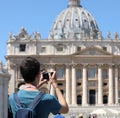 Photographer while taking a picture at Square of Saint Peter wit Royalty Free Stock Photo