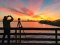 Photographer is taking a picture of sunset with San Francisco Royalty Free Stock Photo