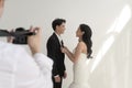 Photographer taking pictures of bride and groom in wedding ceremony, Love ,Romantic and wedding proposal concept Royalty Free Stock Photo