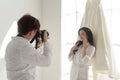 Photographer taking pictures of bride and groom in wedding ceremony, Love ,Romantic and wedding proposal concept Royalty Free Stock Photo