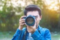 Photographer taking pictures with digital camera. Vintage tone Royalty Free Stock Photo