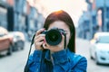 Photographer taking pictures with digital camera. Vintage tone Royalty Free Stock Photo