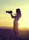 Photographer taking pictures with SLR camera Royalty Free Stock Photo