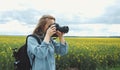 Photographer taking pictures using camera Royalty Free Stock Photo