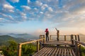 Photographer on the wooden bridge on sunrise at Phu Lam Duan view point Royalty Free Stock Photo