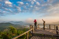 Photographer on the wooden bridge on sunrise at Phu Lam Duan view point Royalty Free Stock Photo