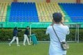 photographer taking pre-wedding moments at the stadium