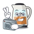 Photographer tea maker is served in cartoon bottle Royalty Free Stock Photo