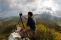 Photographer on top of the mountain Royalty Free Stock Photo