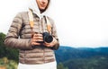 Photographer traveler on green mountain, tourist holding in hands digital photo camera closeup, hiker taking click photography Royalty Free Stock Photo