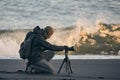 Photographer with tripod on an Icelandic beach Royalty Free Stock Photo