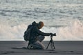 Photographer with tripod on an Icelandic beach Royalty Free Stock Photo