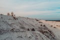 Photographer with a tripod shoots a landscape from the mountain. Phosphate gypsum waste from factories, creating artificial white