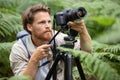 photographer using tripod to take photos Royalty Free Stock Photo