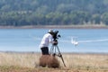 Photographer videographer filming a glider landing in a soaring competition Royalty Free Stock Photo