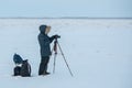 A photographer and a videographer removing the report on the Lena River in Yakutia, Sakha Republic