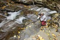 Photographer at waterfall