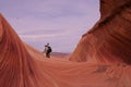 Photographer in Waves of Sandstone Royalty Free Stock Photo