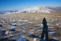 Photographer in winter mountain