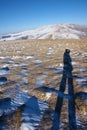 Photographer in winter mountain