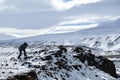 Photographer in wintry mountain landscape, Iceland Royalty Free Stock Photo