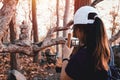 Photographer women using Camera DSLR, Mirror less Digital Single Lens Reflex take a photo stone on tree . Travel Concept. Hiker