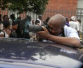 Photographer at work during anti-Mugabe demostration Royalty Free Stock Photo