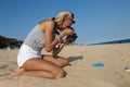 Photographer at work, jewelry photography on the beach Royalty Free Stock Photo