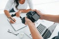 Photographer at work. Two young female freelancers indoors in the office at daytime Royalty Free Stock Photo