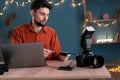 Photographer working at home office. Workflow of freelance photographer. Export or transfer data files and images photos Royalty Free Stock Photo