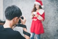 Photographer working with model in studio