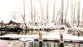 Grey cottage on a snowy river bank Steveston British Columbia near the wooden dock 2