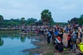 Photographers gather near Angkor Wat pond sunrise