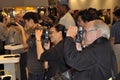 Photographers photograph a female model posing for photographers