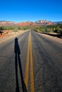 Photographers shadow on road Royalty Free Stock Photo