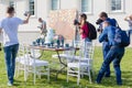 Photographers shoot decorated for wedding elegant dinner table Royalty Free Stock Photo