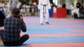 Photographers shoot during a karate competitions